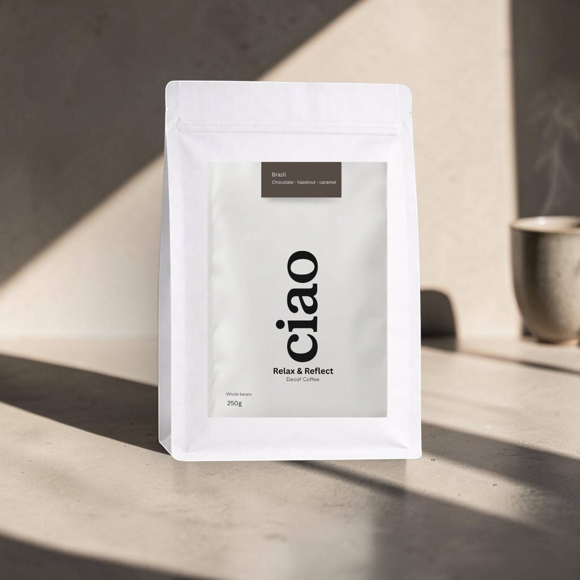 Say Ciao Coffee Relax & Reflect decaf whole bean coffee bag with tasting notes of chocolate, hazelnut, and caramel.