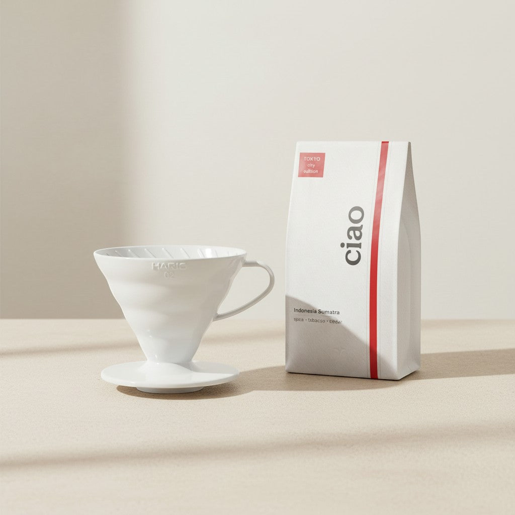 Say Ciao Coffee Tokyo Edition white plastic Hario V60 dripper size 02 with a bag of coffee beans.